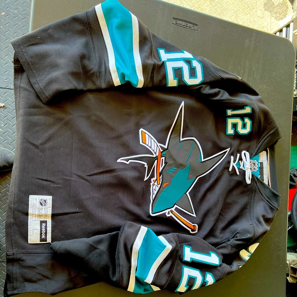 Black Reebok Sharks stitched jersey in a size large
